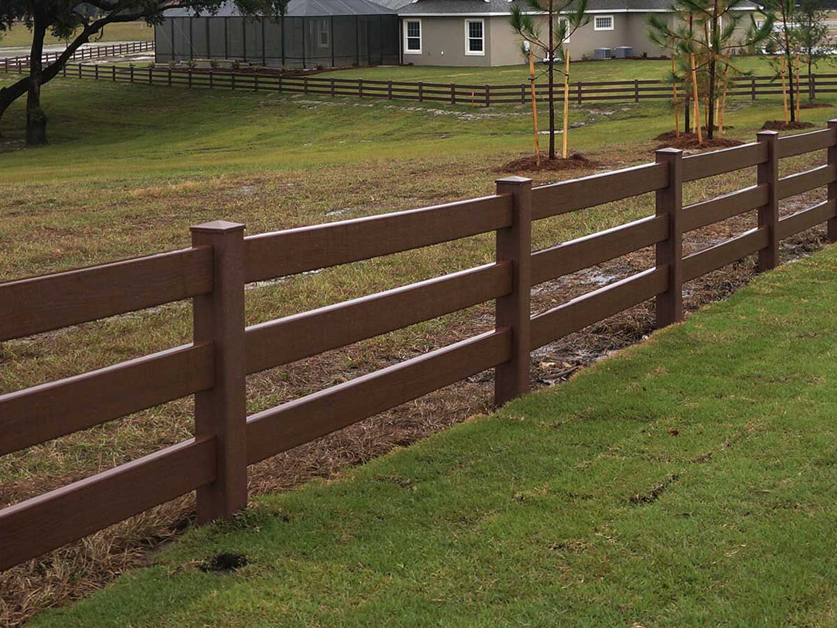 Three-Rail Ranch-Style Vinyl Fence in Wood Tone - Ideal for Large Residential Properties in Walton, KY